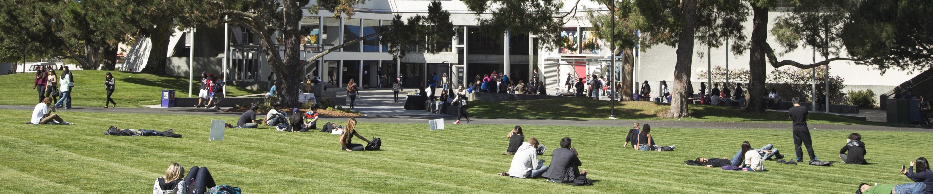 SF State's quad on a sunny day as students lay on the grass